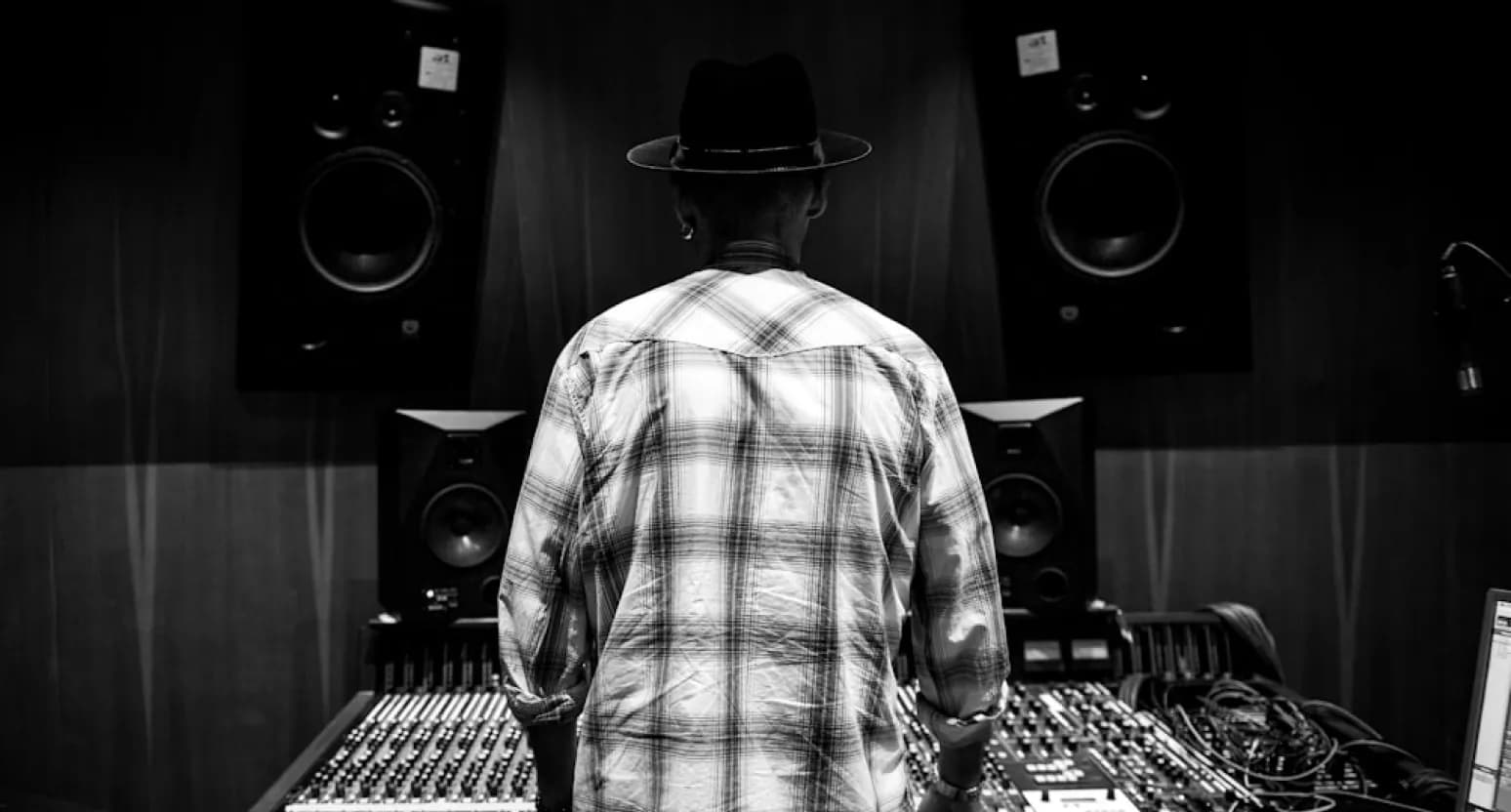 Jimmy Githinji working at an audio mixing console